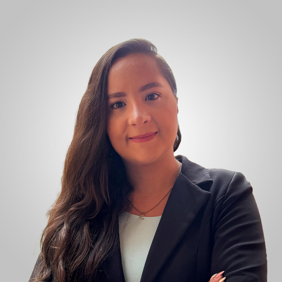 Professional headshot of a businesswoman in a blazer